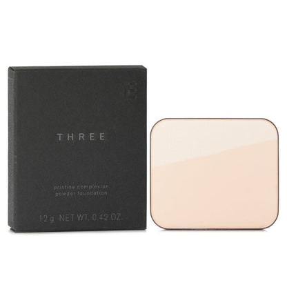 THREE Pristine Complexion Pudergrundierung LSF 26 – Nr. 100 12 g/0,42 oz